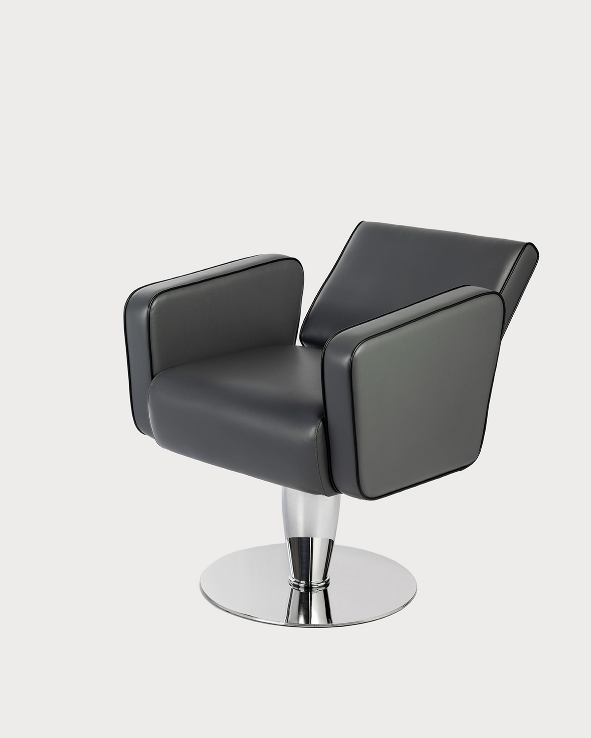 A professional black salon chair with chrome base and adjustable height.