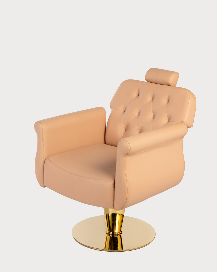 A professional salon chair with a beige upholstered backrest and seat, featuring a gold-colored chrome base and adjustable height.