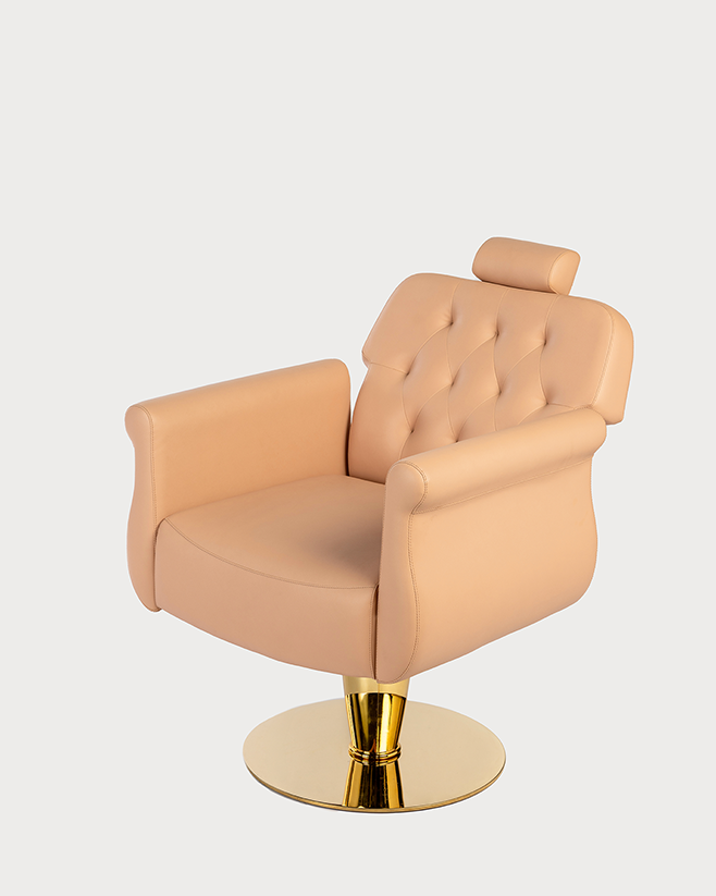 Beige leather chair with gold base on a white background